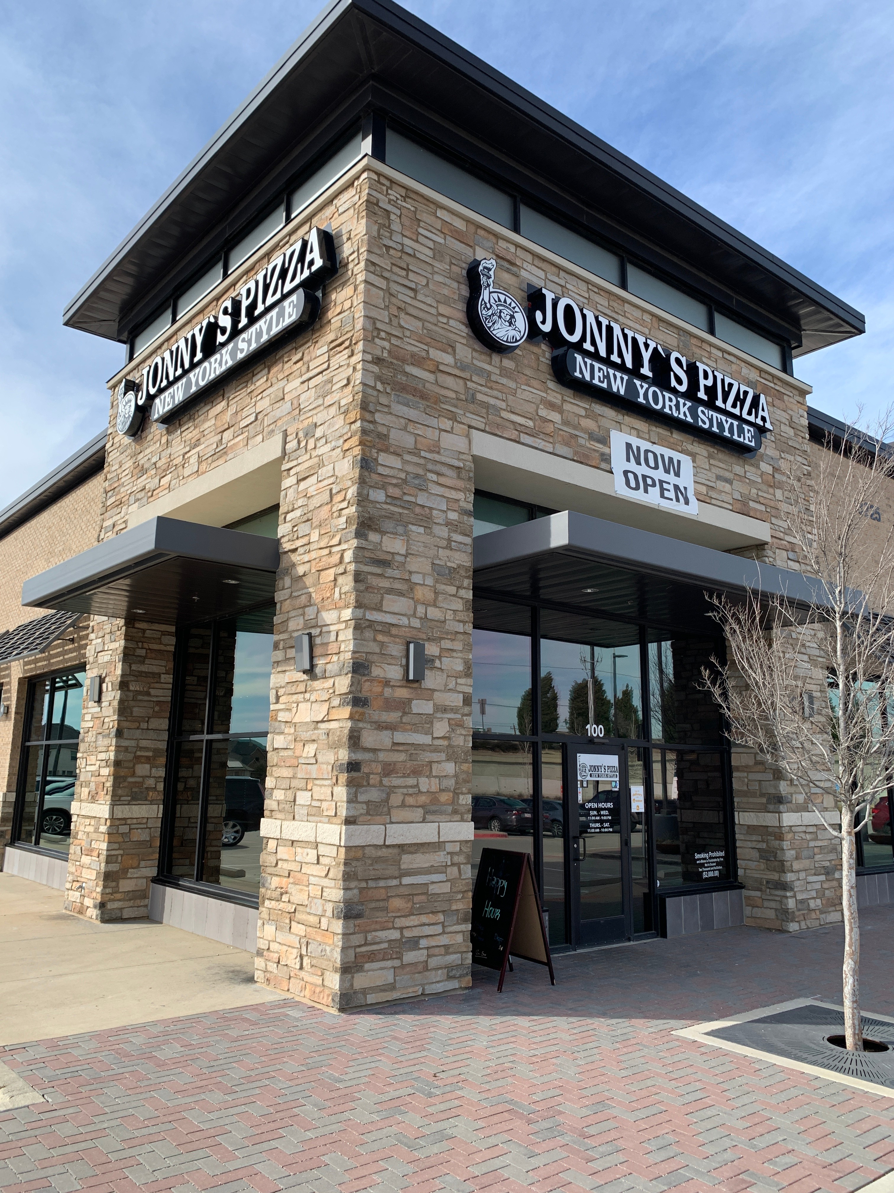 Storefront of Jonny's Pizza in Frisco, Texas