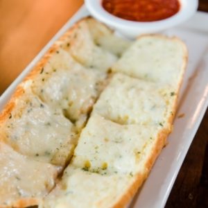Cheesy garlic bread with marinara at Jonny's Pizza in Aubrey and Frisco, TX
